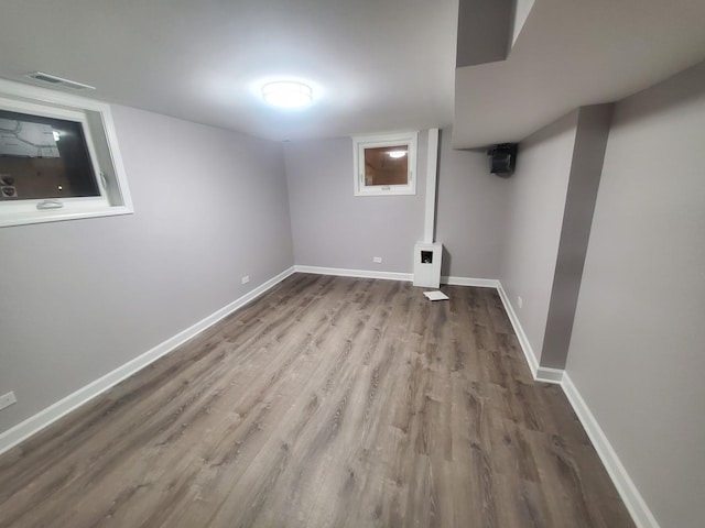 basement featuring hardwood / wood-style flooring