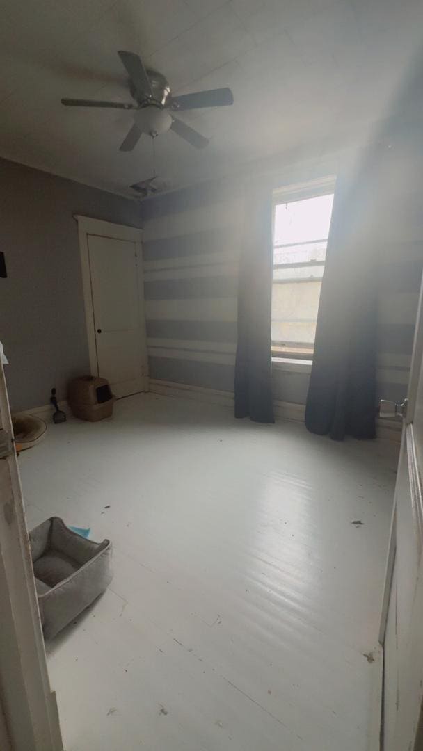 interior space with a ceiling fan