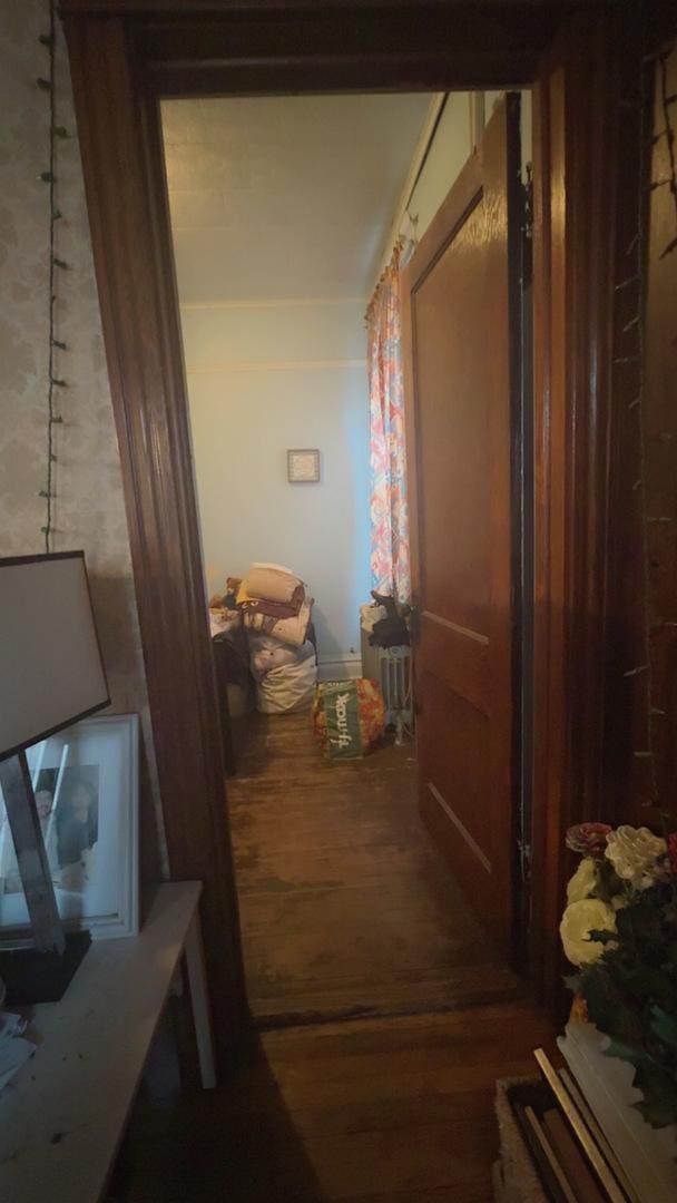 hall with wood finished floors
