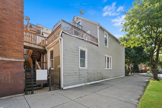 view of property exterior with a balcony