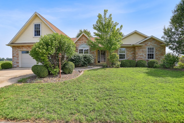 view of front of home with a garage and a front lawn