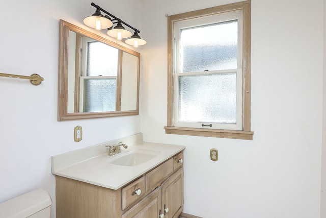 bathroom with vanity and toilet