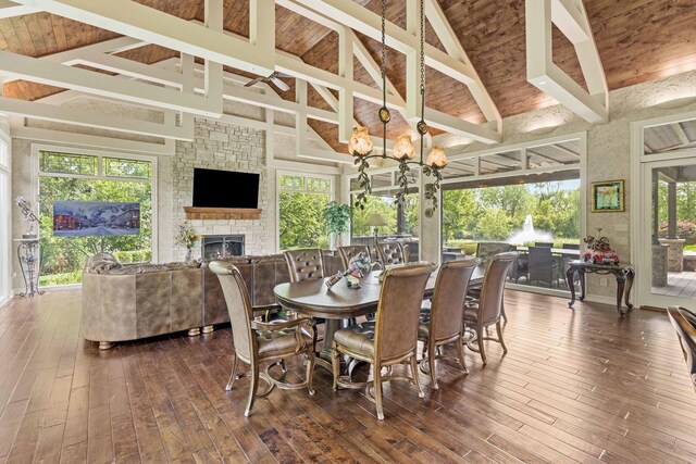 interior space with hardwood / wood-style flooring, a fireplace, high vaulted ceiling, and wood ceiling