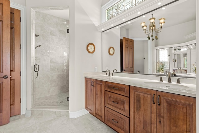 bathroom featuring tile patterned flooring, an enclosed shower, a chandelier, and dual bowl vanity