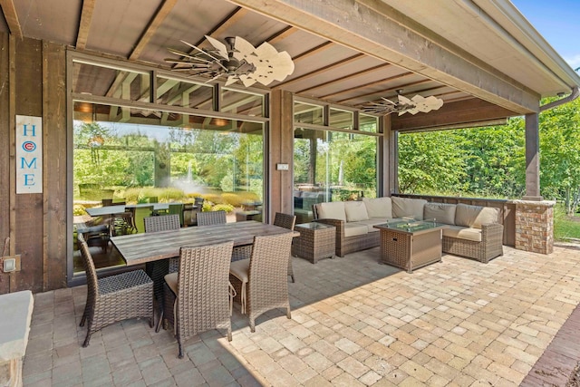 view of patio / terrace with an outdoor living space and ceiling fan