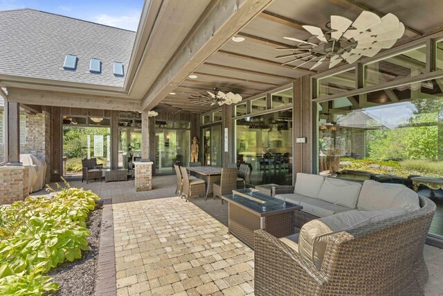 view of patio featuring ceiling fan and an outdoor hangout area