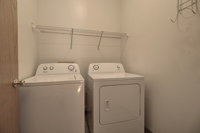 laundry area featuring washing machine and clothes dryer