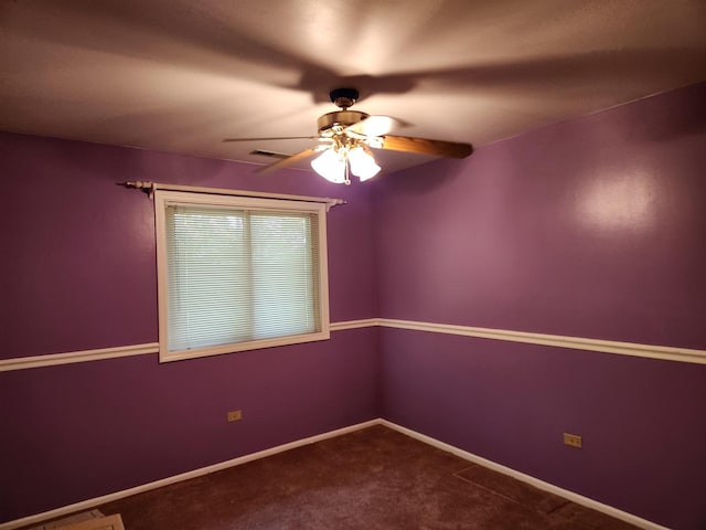 spare room featuring carpet and ceiling fan