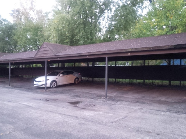 view of parking / parking lot with a carport