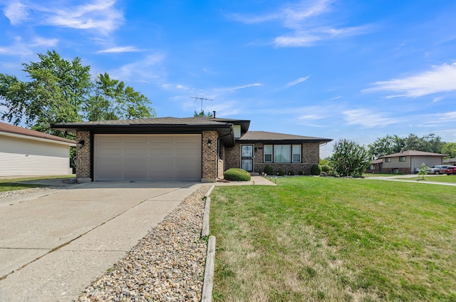 view of front of property with a front lawn and a garage