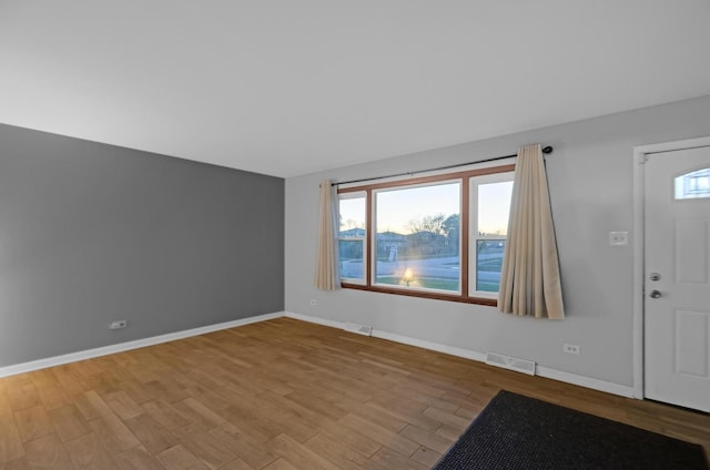 living room with light hardwood / wood-style flooring