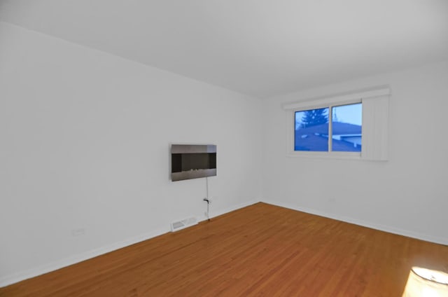 kitchen with ceiling fan, white cabinets, light wood-type flooring, and appliances with stainless steel finishes