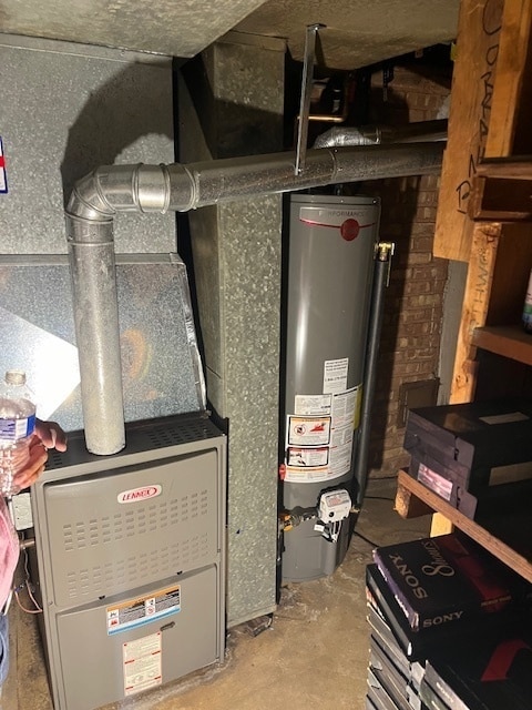 utility room with water heater