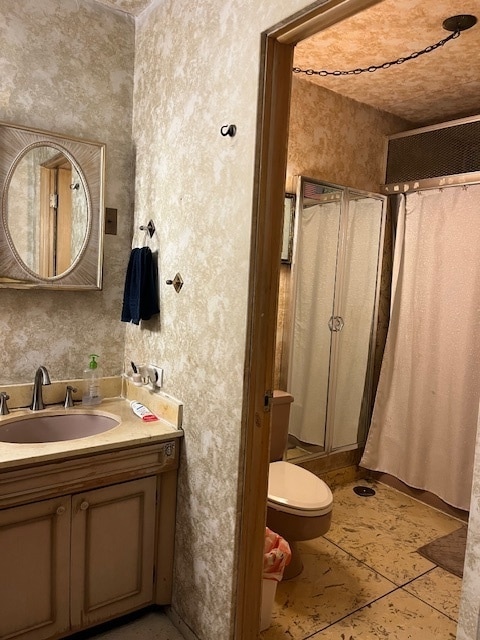 bathroom featuring tile patterned floors, toilet, and vanity