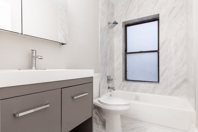 full bathroom featuring tile patterned flooring, toilet, vanity, and tiled shower / bath