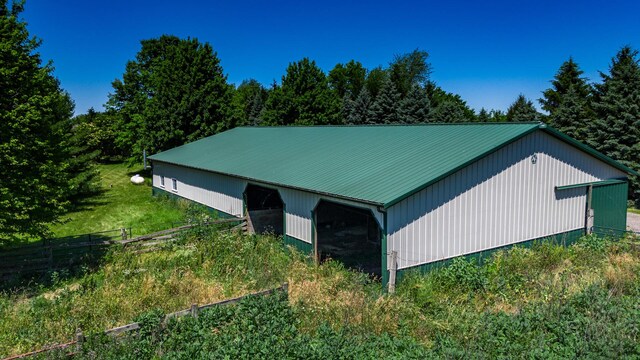 view of side of property with an outbuilding