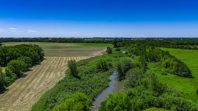 birds eye view of property with a rural view