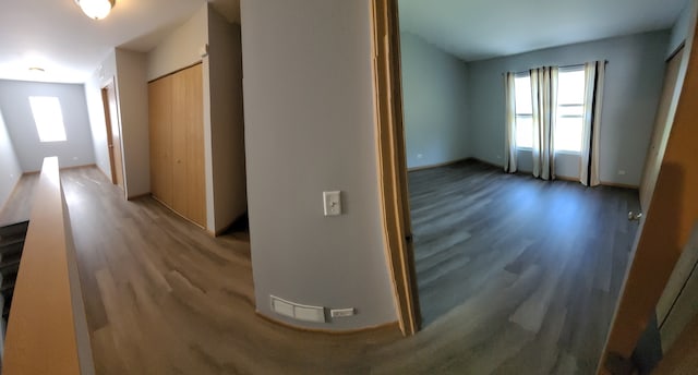 hall with hardwood / wood-style floors