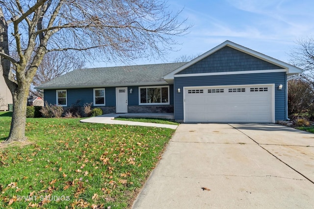 single story home featuring a garage and a front lawn