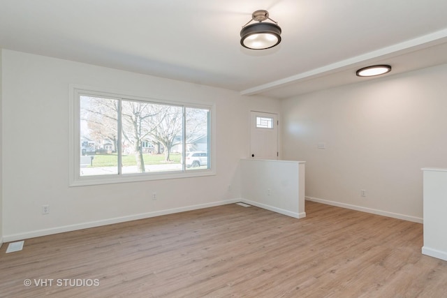 spare room featuring light hardwood / wood-style flooring