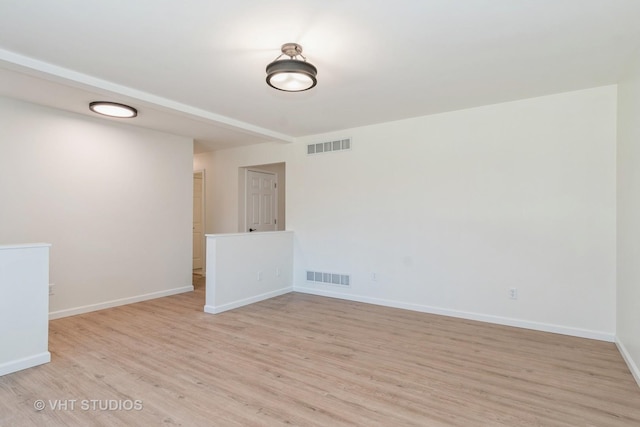 empty room with light wood-type flooring