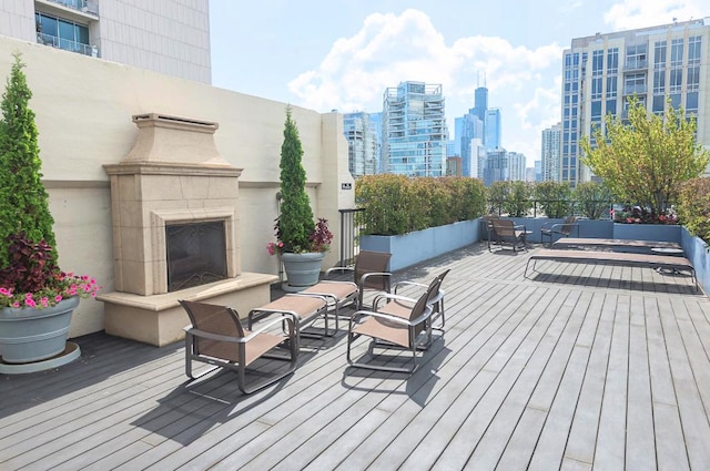 758 N Larrabee St Unit 811, Chicago, IL 60654 - deck with a skyline view and an outdoor living space with a fireplace
