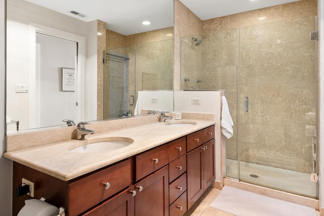 758 N Larrabee St Unit 811, Chicago, IL 60654 - bathroom featuring a sink, a stall shower, double vanity, and visible vents