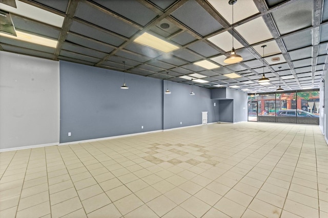 spare room with coffered ceiling