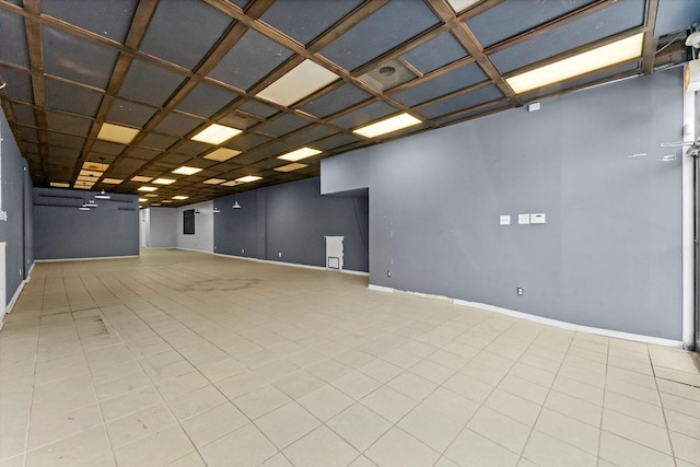 empty room featuring coffered ceiling