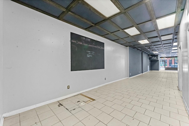 spare room with coffered ceiling