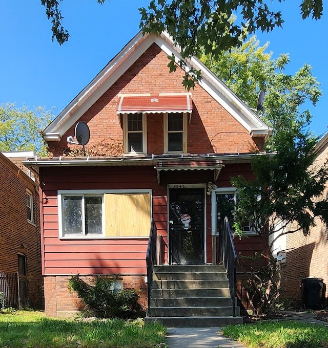 view of front of property featuring brick siding