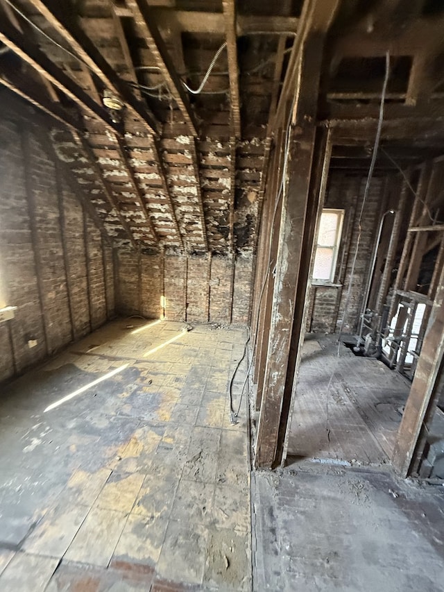 miscellaneous room with lofted ceiling