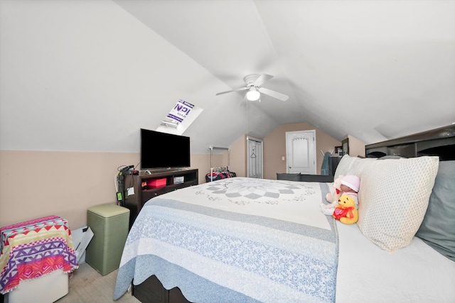 carpeted bedroom with vaulted ceiling and ceiling fan