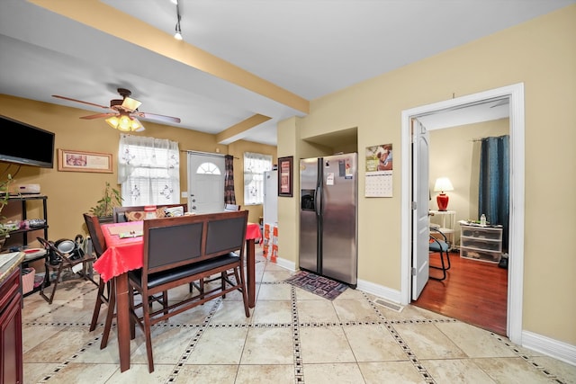 dining room with light hardwood / wood-style flooring and ceiling fan