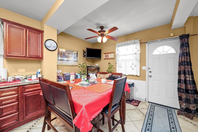 dining room with ceiling fan and light tile patterned floors