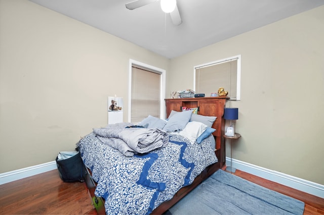 bedroom with wood-type flooring and ceiling fan