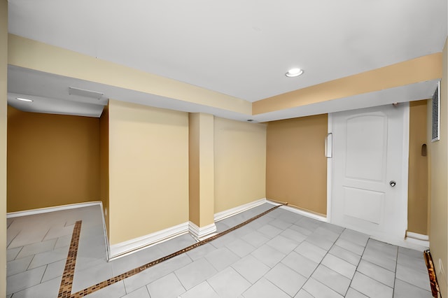 basement with light tile patterned floors