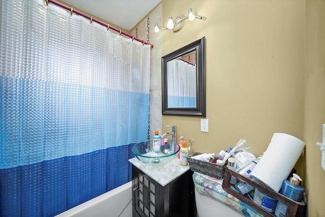 bathroom featuring vanity and shower / bath combination with curtain