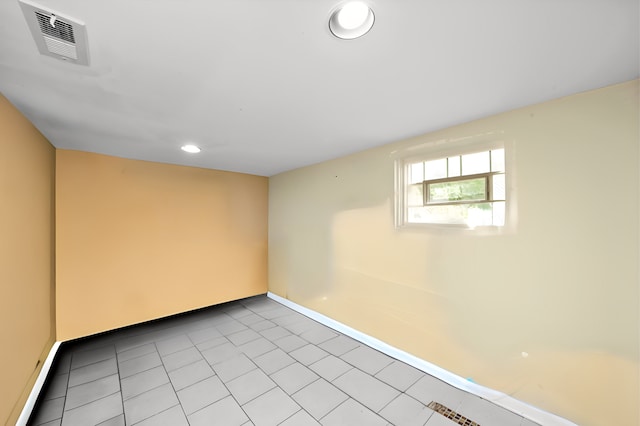 basement featuring light tile patterned floors