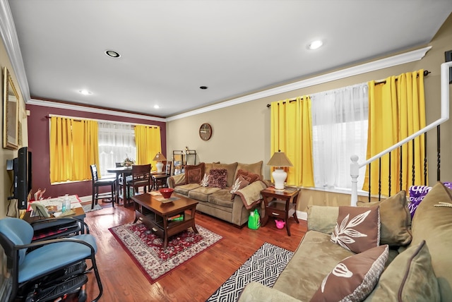 living room featuring crown molding and wood-type flooring