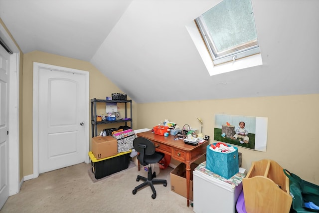 home office with lofted ceiling with skylight