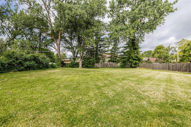 view of yard with fence