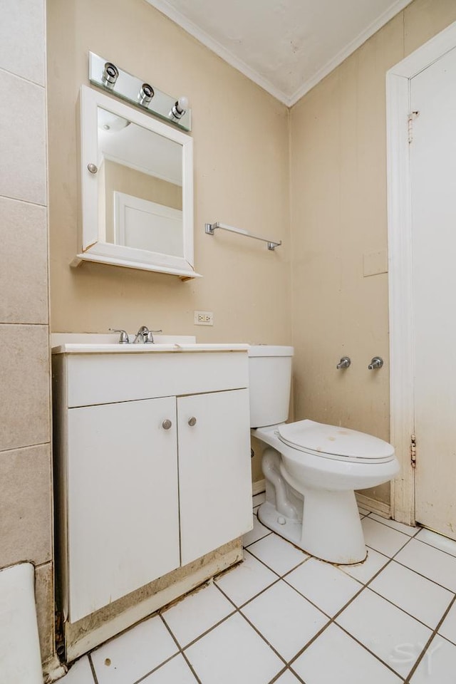 half bath with tile patterned flooring, vanity, toilet, and crown molding