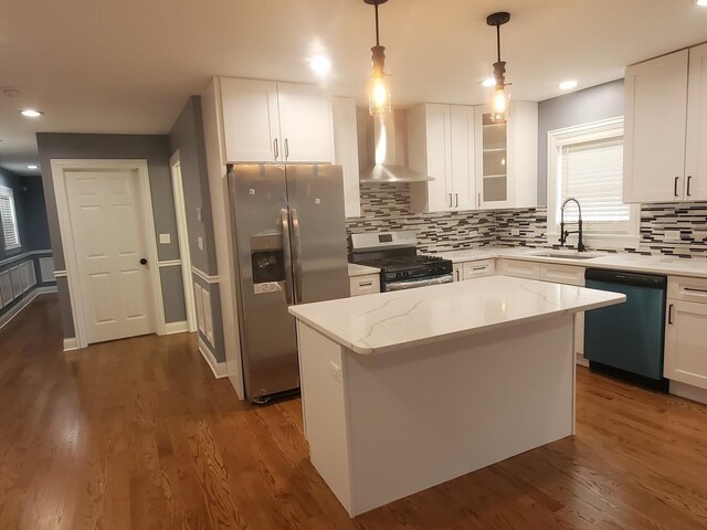 kitchen with range with gas cooktop, sink, stainless steel fridge with ice dispenser, black dishwasher, and wall chimney range hood