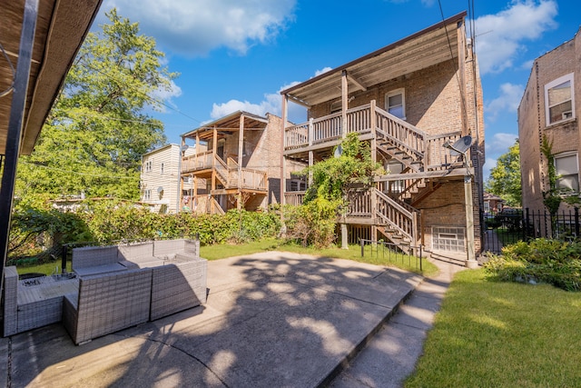 exterior space featuring a lawn, a patio, and an outdoor hangout area