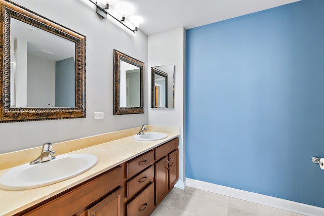 bathroom with tile patterned flooring and double vanity