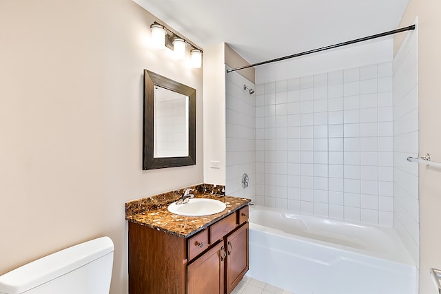 full bathroom with tiled shower / bath combo, tile patterned flooring, toilet, and vanity