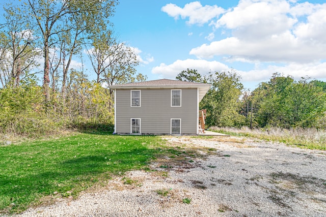 view of property exterior featuring a yard