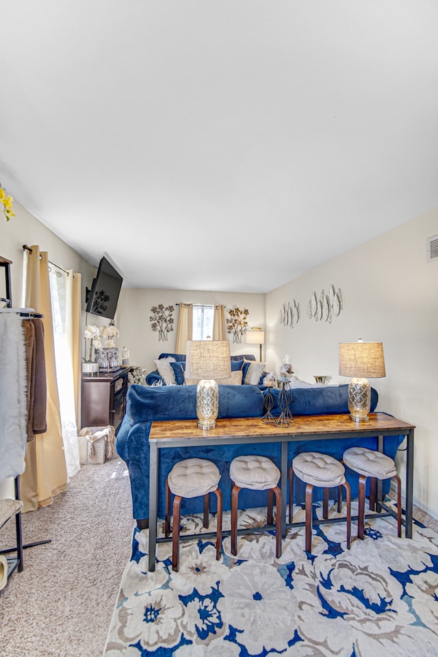 dining space with light carpet