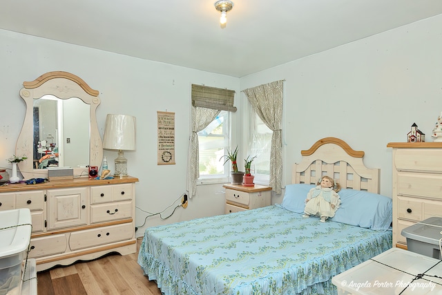 bedroom with light hardwood / wood-style flooring